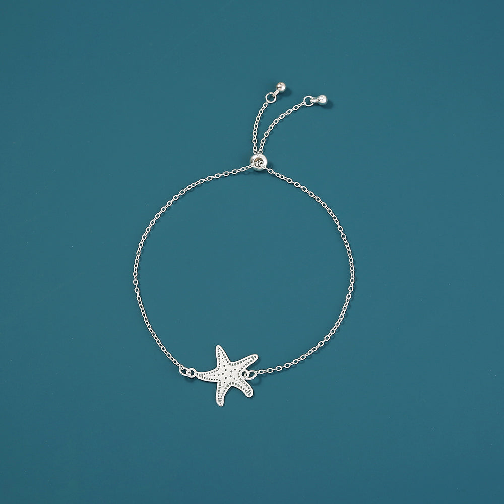 Silver starfish, glow-in-the-dark shrink bracelet